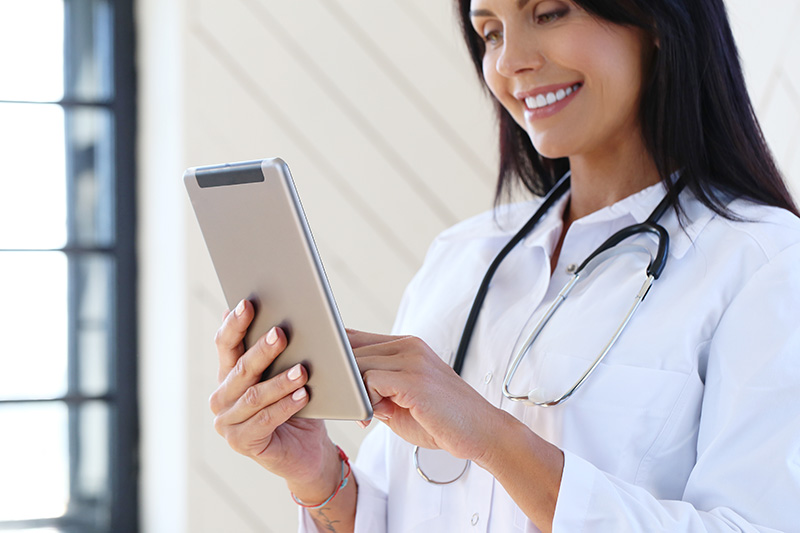 Photo of a doctor using TeleComp mobility communications services Photo of a doctor using TeleComp mobility communications services