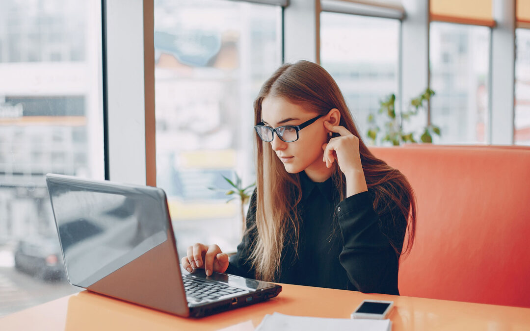 Photo of a woman in an office accessing secure data